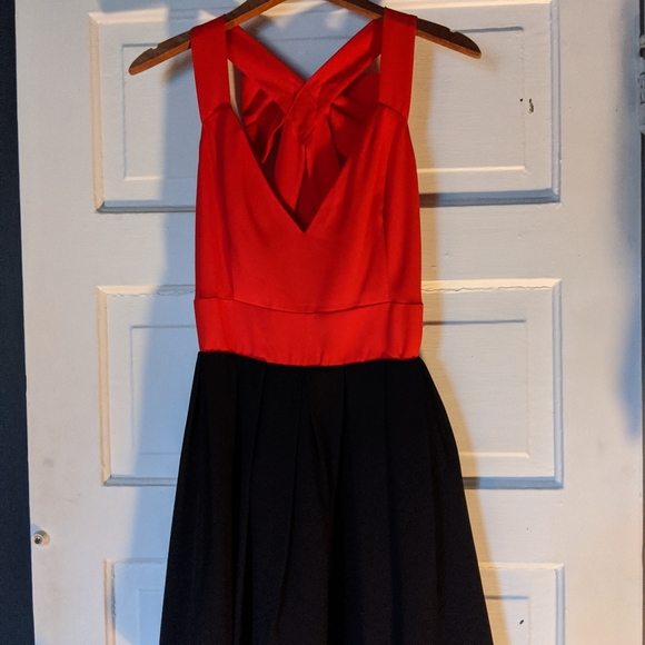 Open Back Bow dress with black mini skirt. - Picture 1 of 8